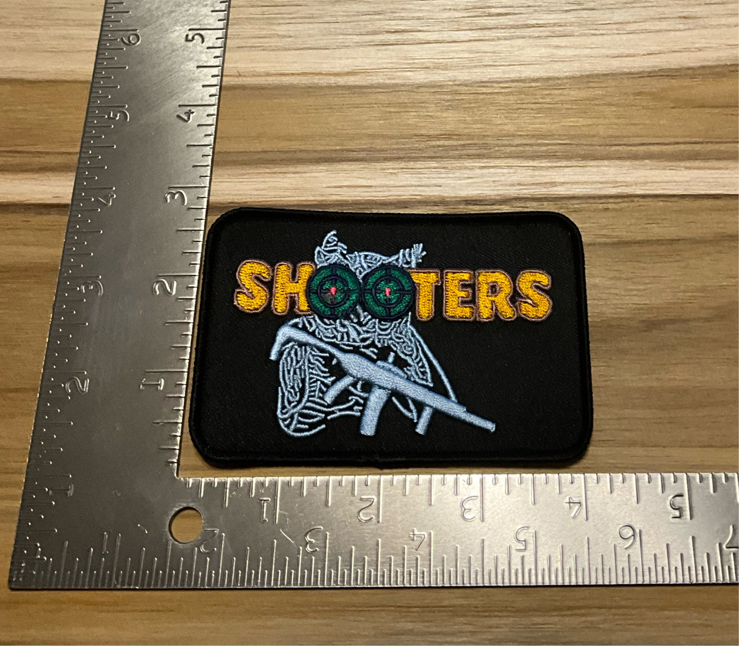 Shooters black/silver-blue patch