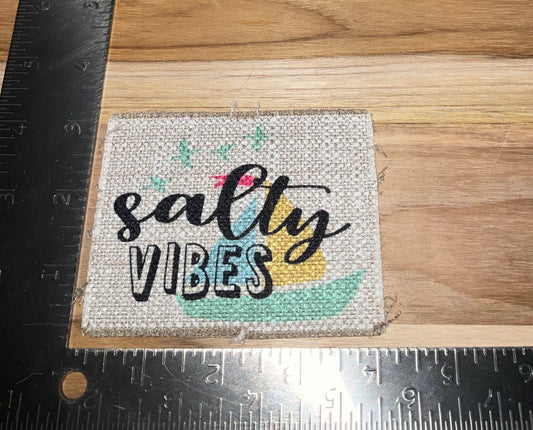 Her patch "salty vibes" tan